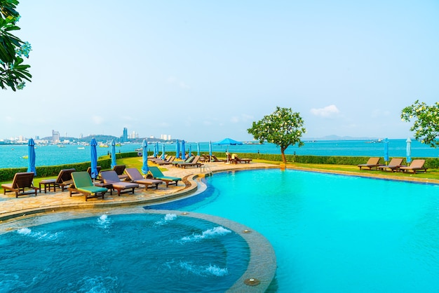 Pool beds and umbrellas around swimming pool