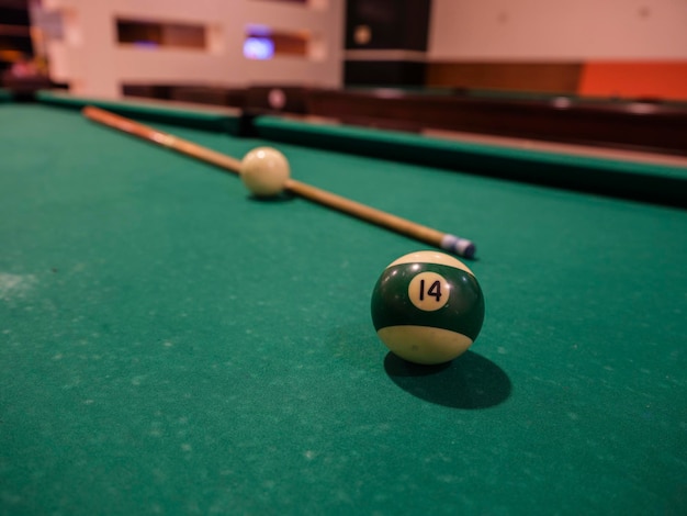 Pool table balls and cue