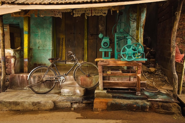 Poor asian village old houses dirty place and old production equipment