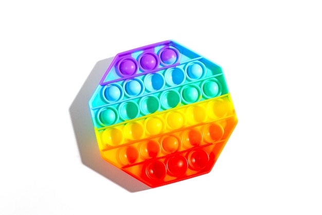 Pop it antistress toy for children rainbow octagon isolated on white background Pop it toy