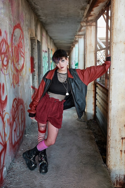 Pop punk aesthetic portrait of woman posing inside building