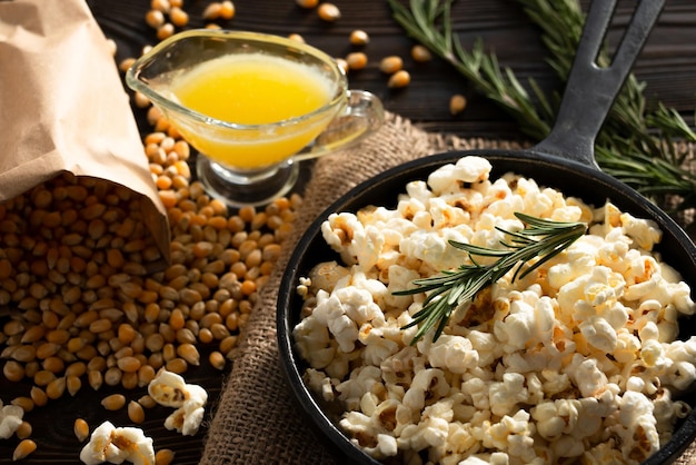 Popcorn in cast iron skillet with melted butter aside