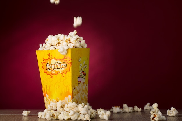 Popcorn isolated in red background