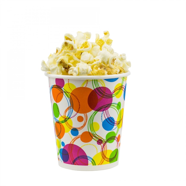 Popcorn in multi-colored festive glass on a white surface