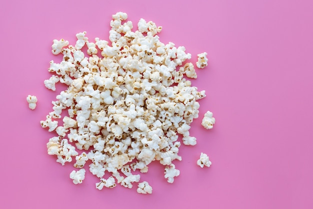 Popcorn on pink. Copy space