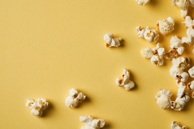 Popcorn on a yellow backgroundCopy space Pop corn collection Different sizes of popcorn