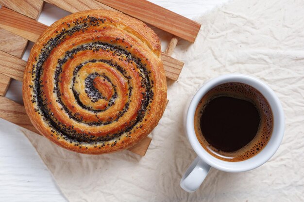 Poppy seed bun and coffee