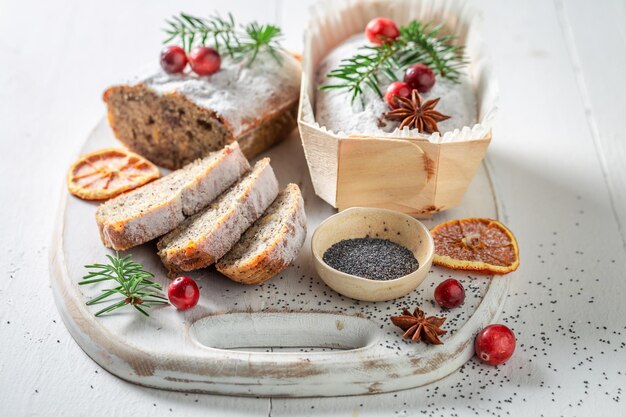 Poppy seed cake ornamented with spruce for Christmas