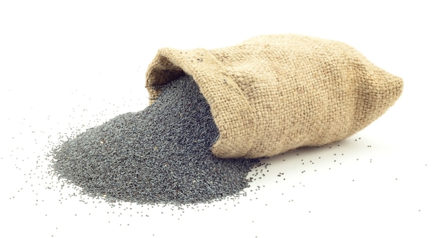 Poppy seeds in the bag on a white surface