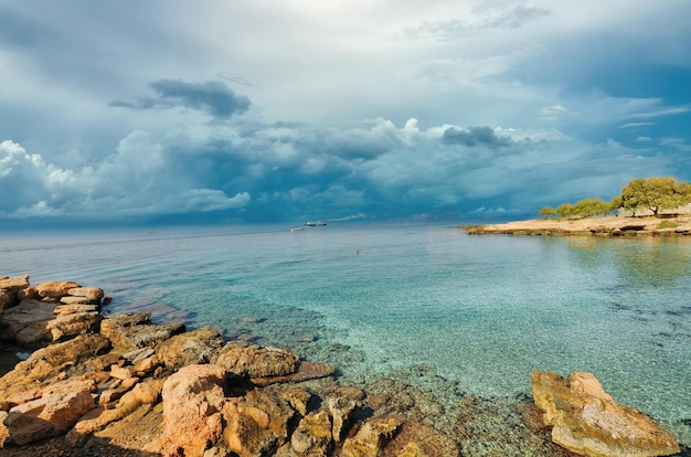 Popular beach of Lighthouse with turquoise sea on the island of Aegina Greece