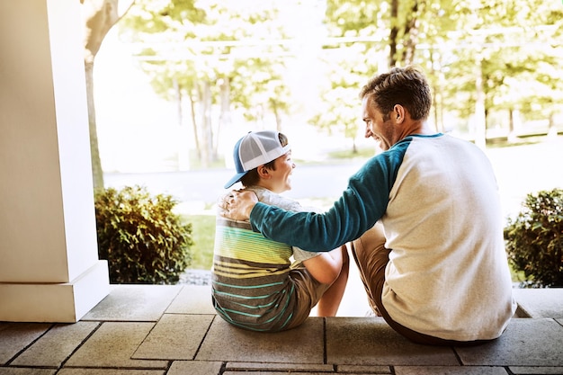 Photo porch hug and father with son sunshine and happiness with weekend break bonding together and relax single parent outdoor and papa with boy family and cheerful with conversation home and summer