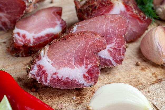 Pork and bacon sliced during cooking