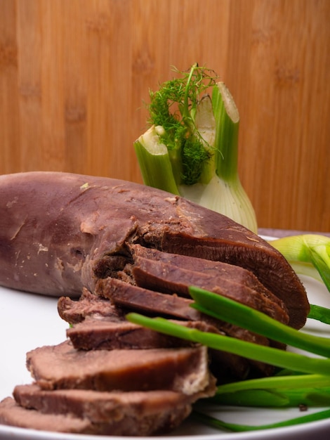 Pork or beef tongue slices with chinese cabbage green onion fennel Russian national cuisine