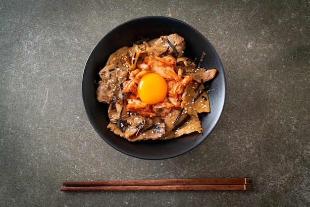 Pork bulgogi rice bowl with kimchi and Korean pickled egg Korean food style