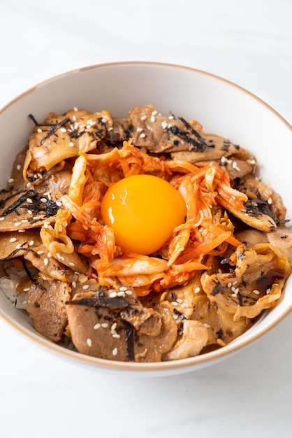 Pork bulgogi rice bowl with kimchi and Korean pickled egg