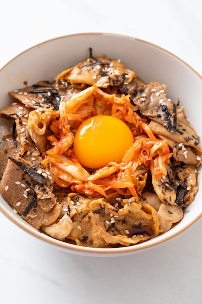 Pork bulgogi rice bowl with kimchi and Korean pickled egg