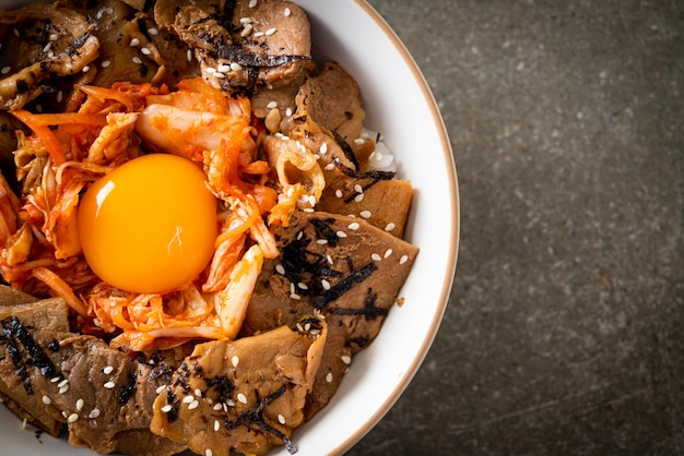 pork bulgogi rice bowl with kimchi and Korean pickled egg