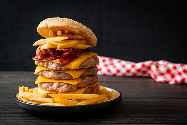 Pork burger with cheese bacon and french fries