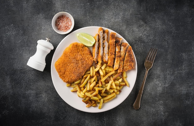 Pork cutlet with french fries top view