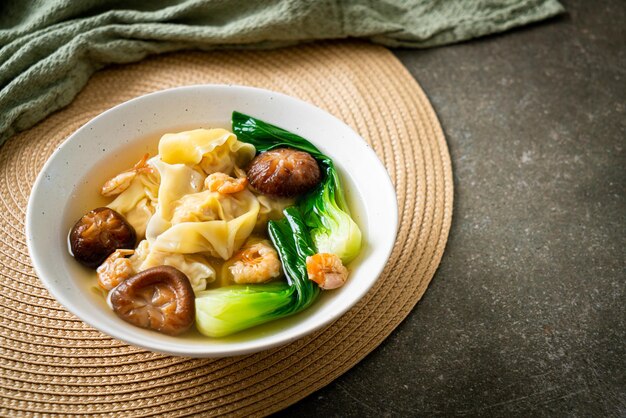 Pork dumpling soup with shrimps and vegetable