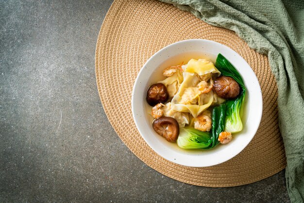 Pork dumpling soup with shrimps and vegetable