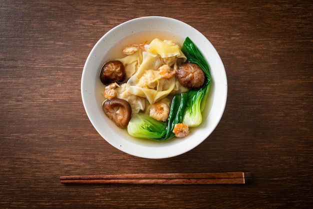 Pork dumpling soup with shrimps and vegetable