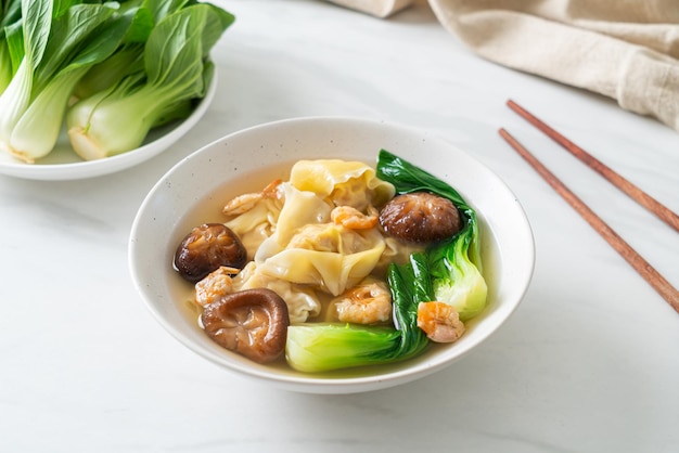 Pork dumpling soup with shrimps and vegetable