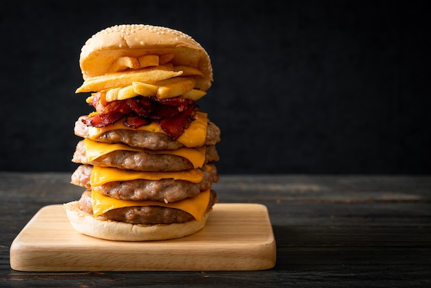 pork hamburger or pork burger with cheese, bacon and french fries