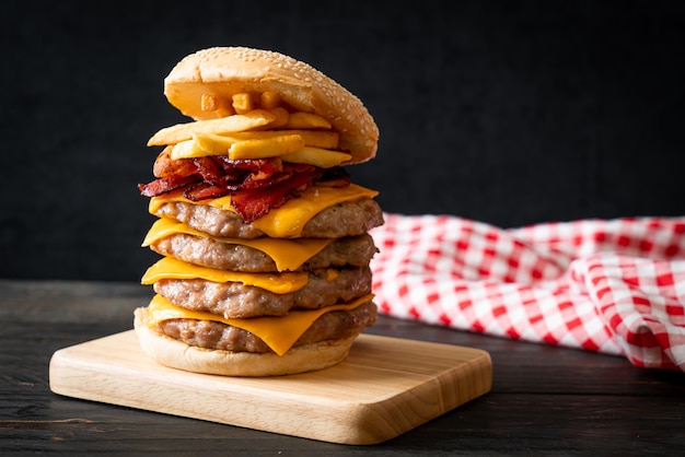 pork hamburger or pork burger with cheese, bacon and french fries