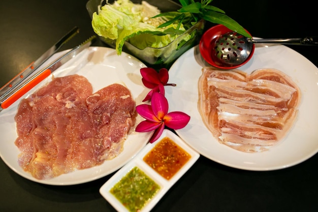 Pork meat or seafood and vegetables on the hot pan Korean Barbecue in Thai style  MooKata