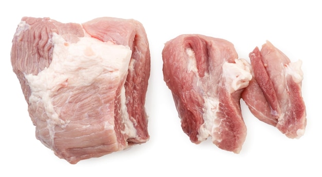 Pork meat sliced into pieces on a white background isolated Top view