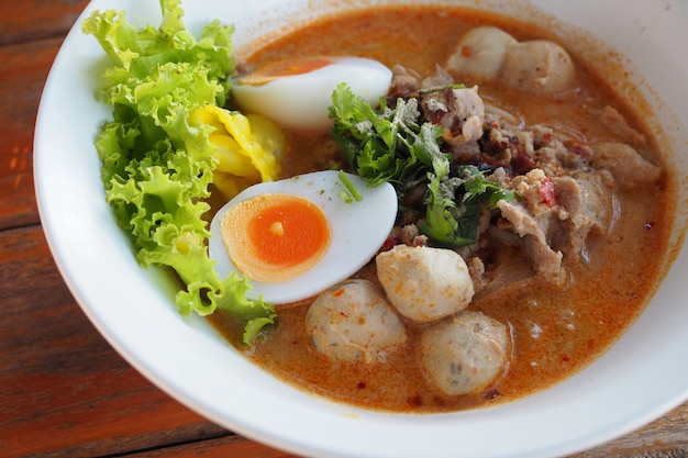 Pork noodle tom yum with condensed water egg