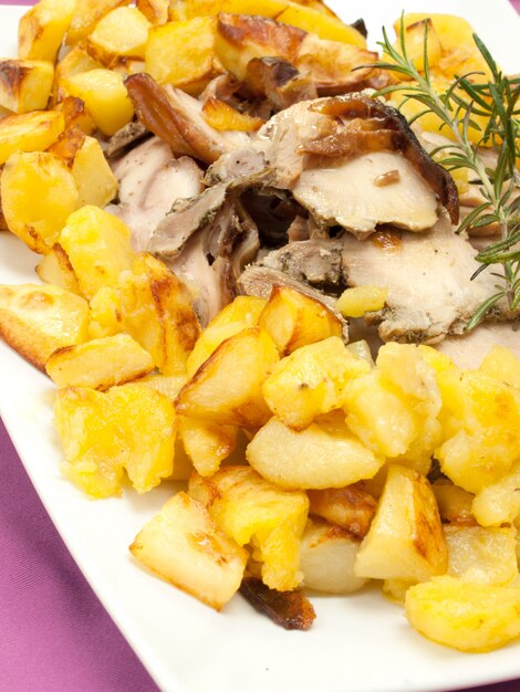 pork and potatoes roasted with olive oil and rosemary