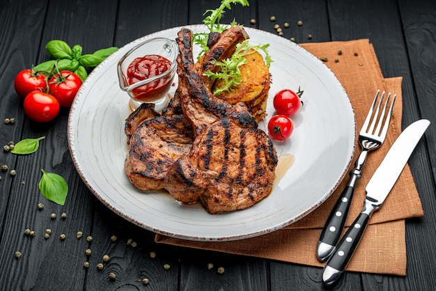 Pork steak with bone and potato pancakes