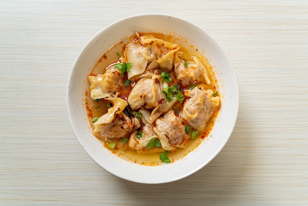 pork wonton soup or pork dumplings soup with roasted chili - Asian food style