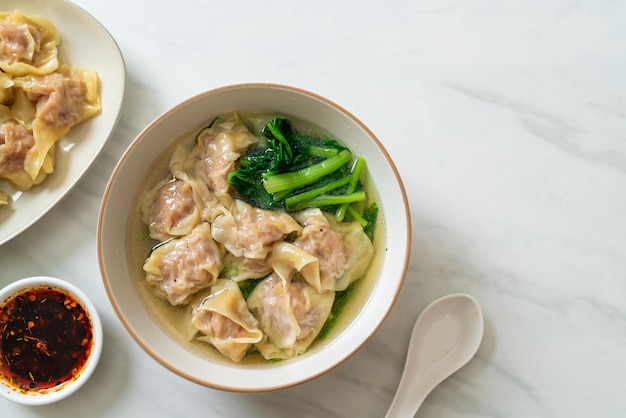 Pork wonton soup or pork dumplings soup with vegetable