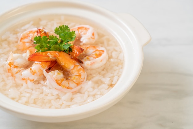 porridge or boiled rice soup with shrimps bowl