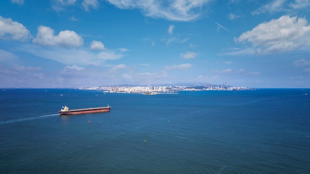 Port terminal freighter and city skyline