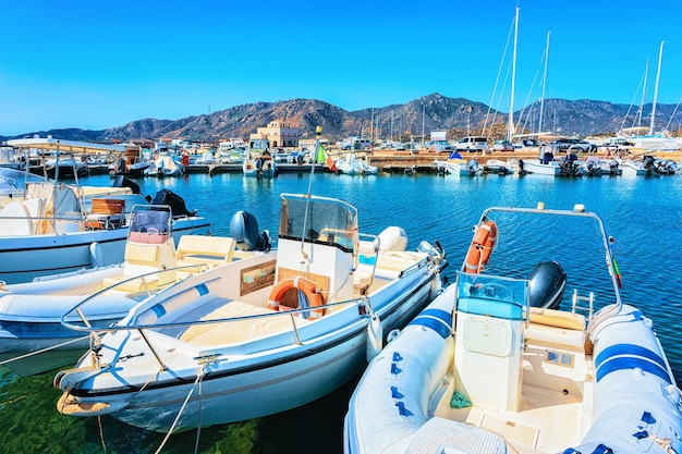 Port with ships and yachts at Villasimius, Cagliari, Sardinia in Italy