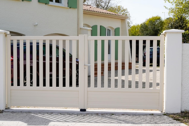 Portal beige steel metal gate white of home suburb street access house garden