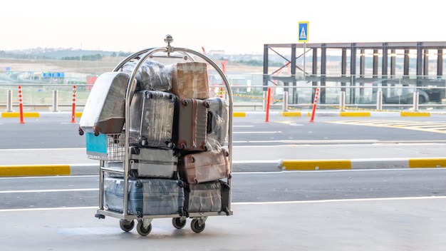 Porter cart with suitcase at the airport