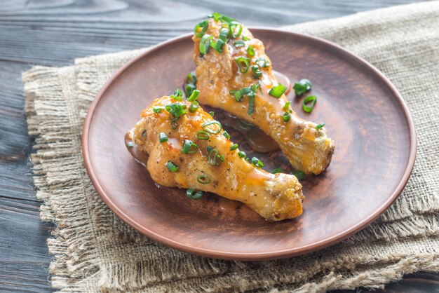 Portion of baked chicken drumsticks