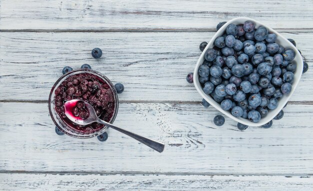 Portion of Blueberries preserved on wooden background selective focus