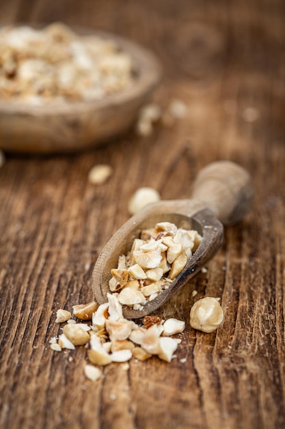 Portion of freshly chopped Hazelnuts close up selective focus