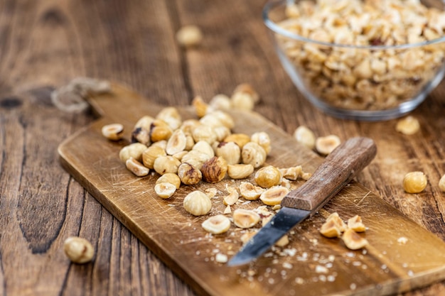 Portion of freshly chopped Hazelnuts close up selective focus