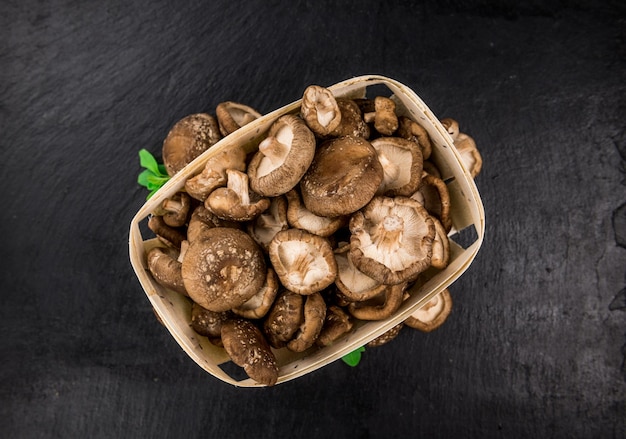 Portion of Raw Shiitake mushrooms on a slate slab