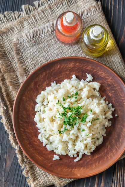 Portion of risotto on the wooden table