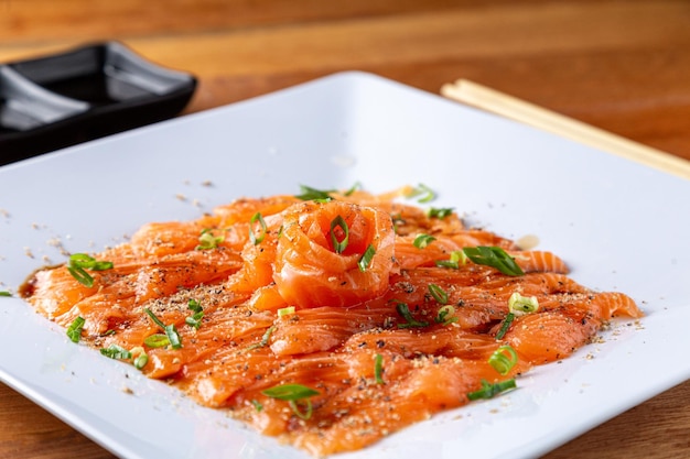 Portion of sashimi on the wooden table