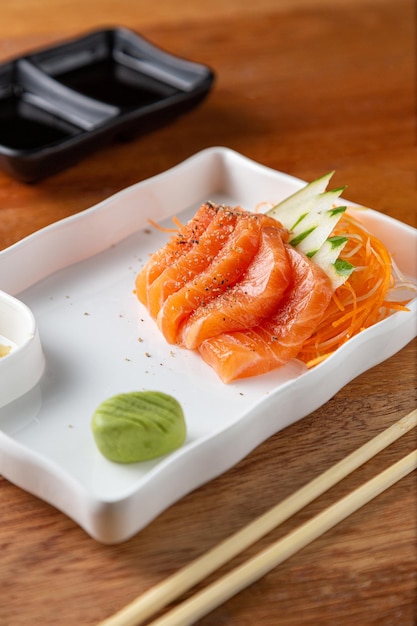 Portion of sashimi on the wooden table