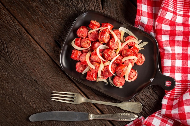 Portion of sausage with onion